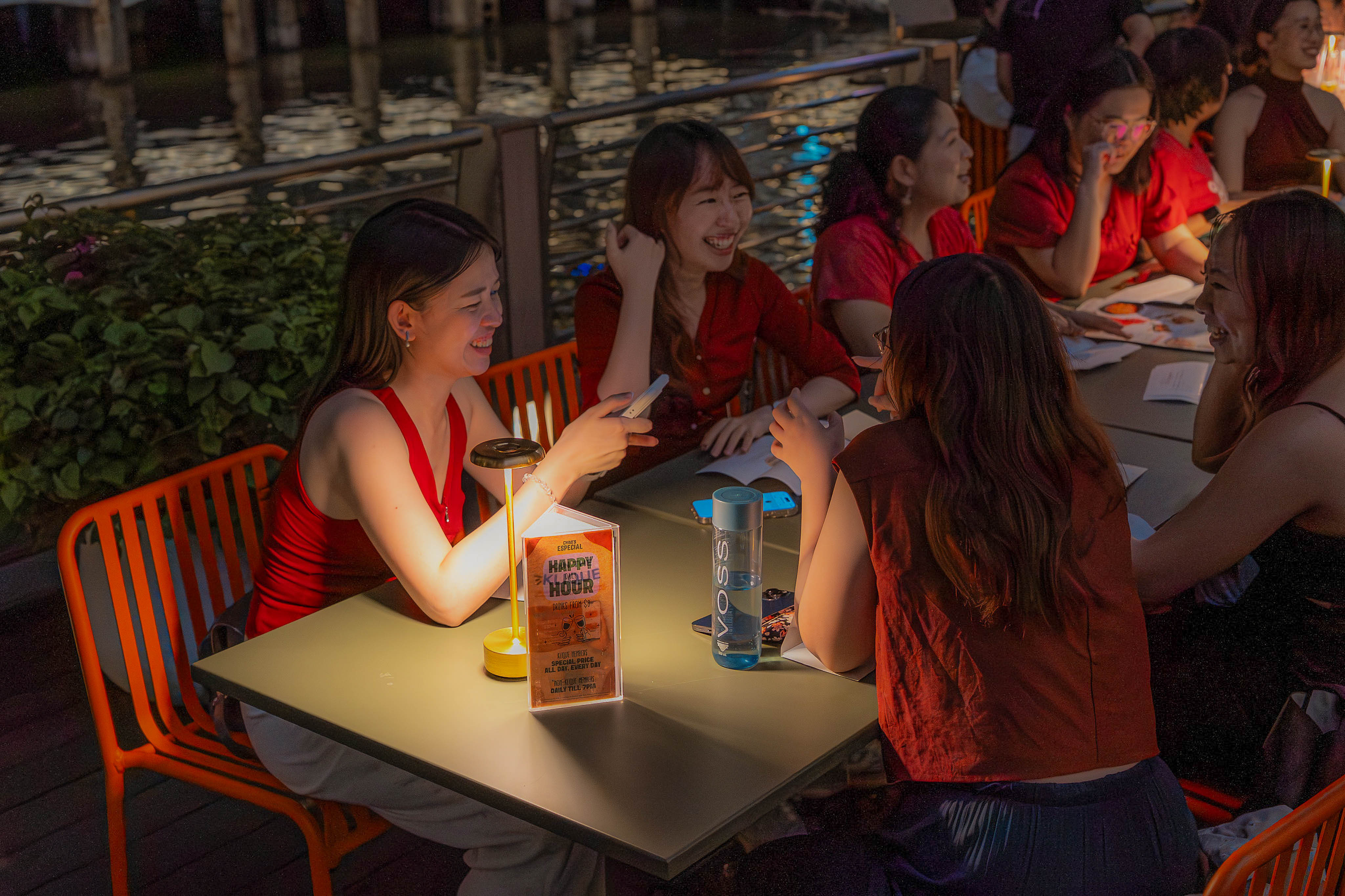 Riverside tables under the night sky